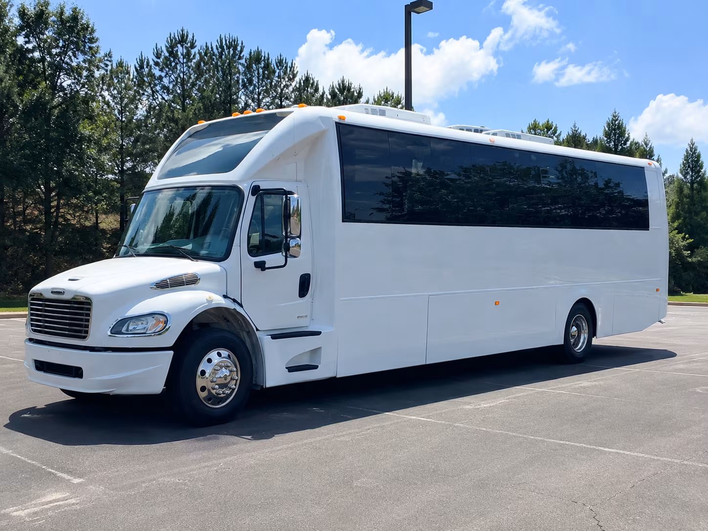 Group beside a Mercedes Sprinter limo in Orlando